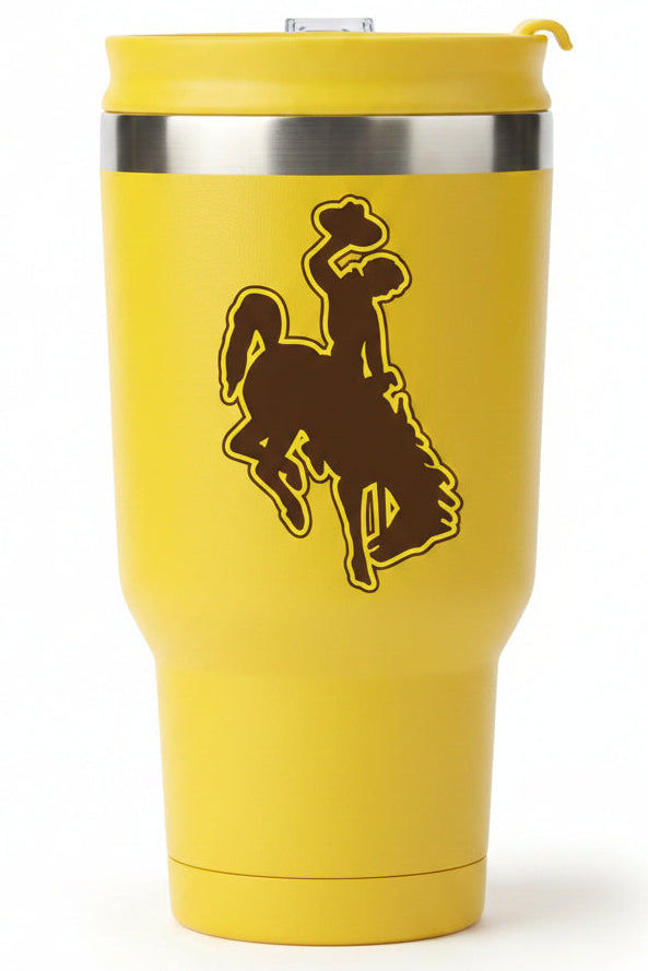 A yellow insulated travel tumbler with a matching yellow lid, featuring a dark brown silhouette of a cowboy on a bucking horse on the front and a silver metallic band near the top.