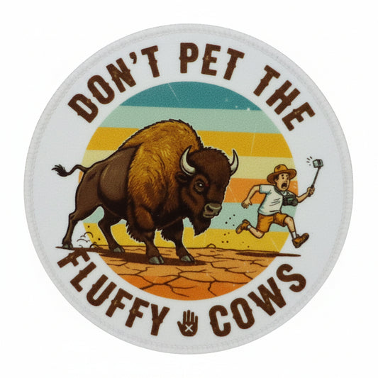 Round sticker with a bison and person, text 'Don't pet the fluffy cows' 