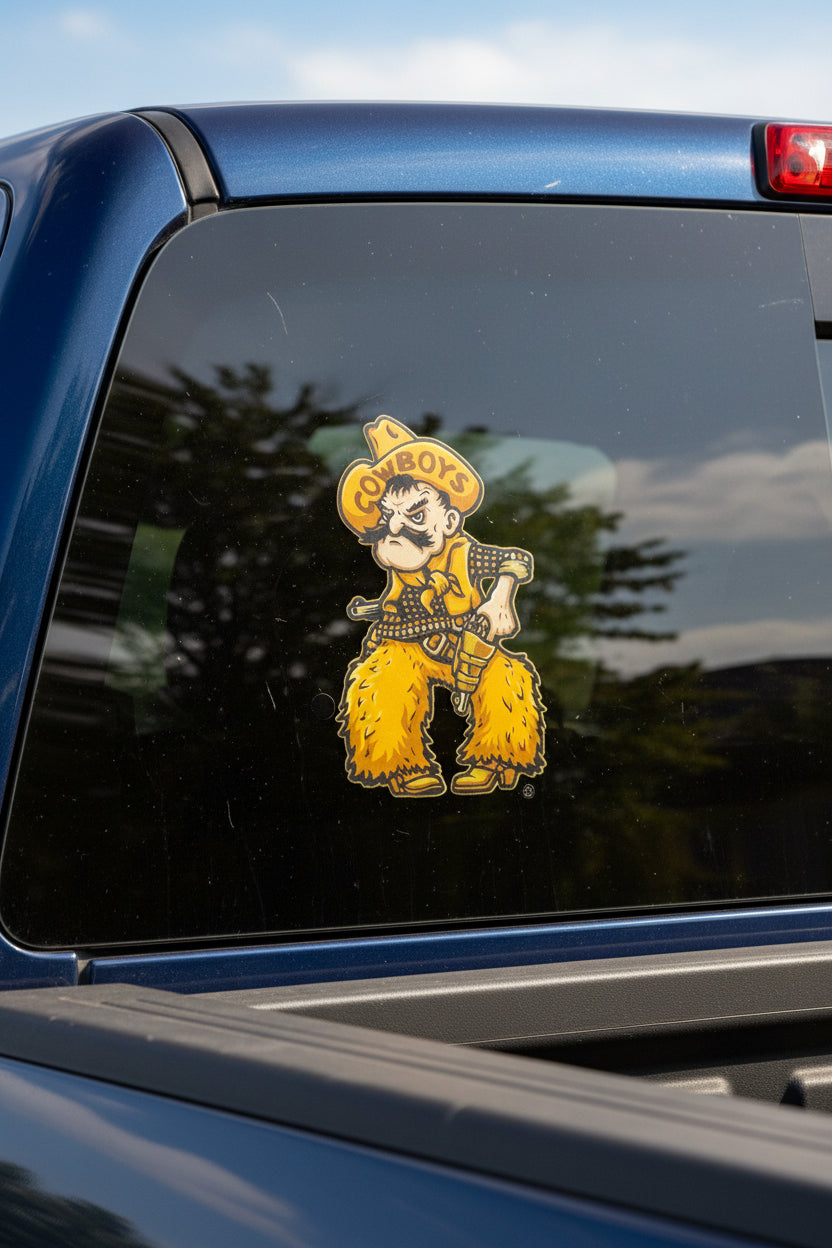 University of Wyoming Cowboy Joe mascot wearing a yellow hat with the word 'COWBOYS' and holding a gun Sticker on a Truck window