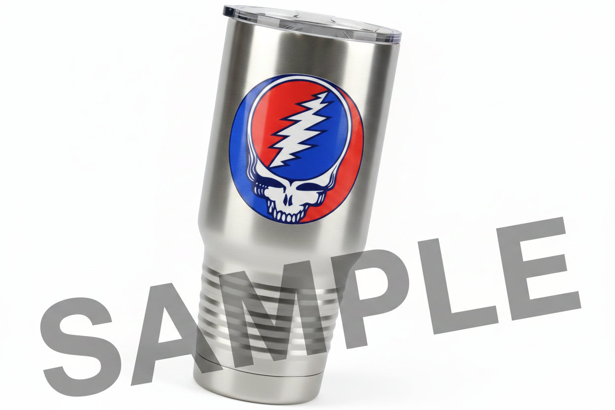 A circular Grateful Dead Steal the Night skull sticker or decal, featuring the iconic red and blue half-sky design with a white lightning bolt and white skull in the center, stainless steel tumbler.