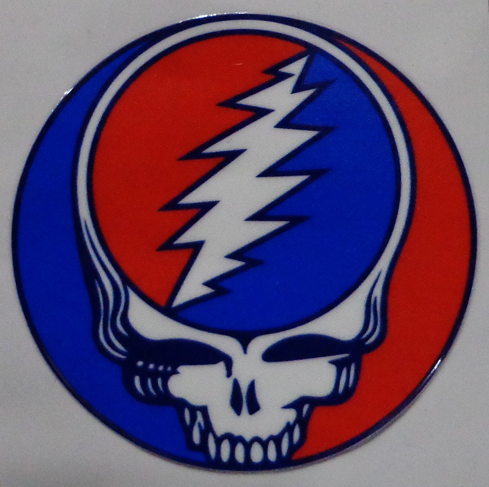 A circular Grateful Dead Steal the Night skull sticker or decal on a white background.