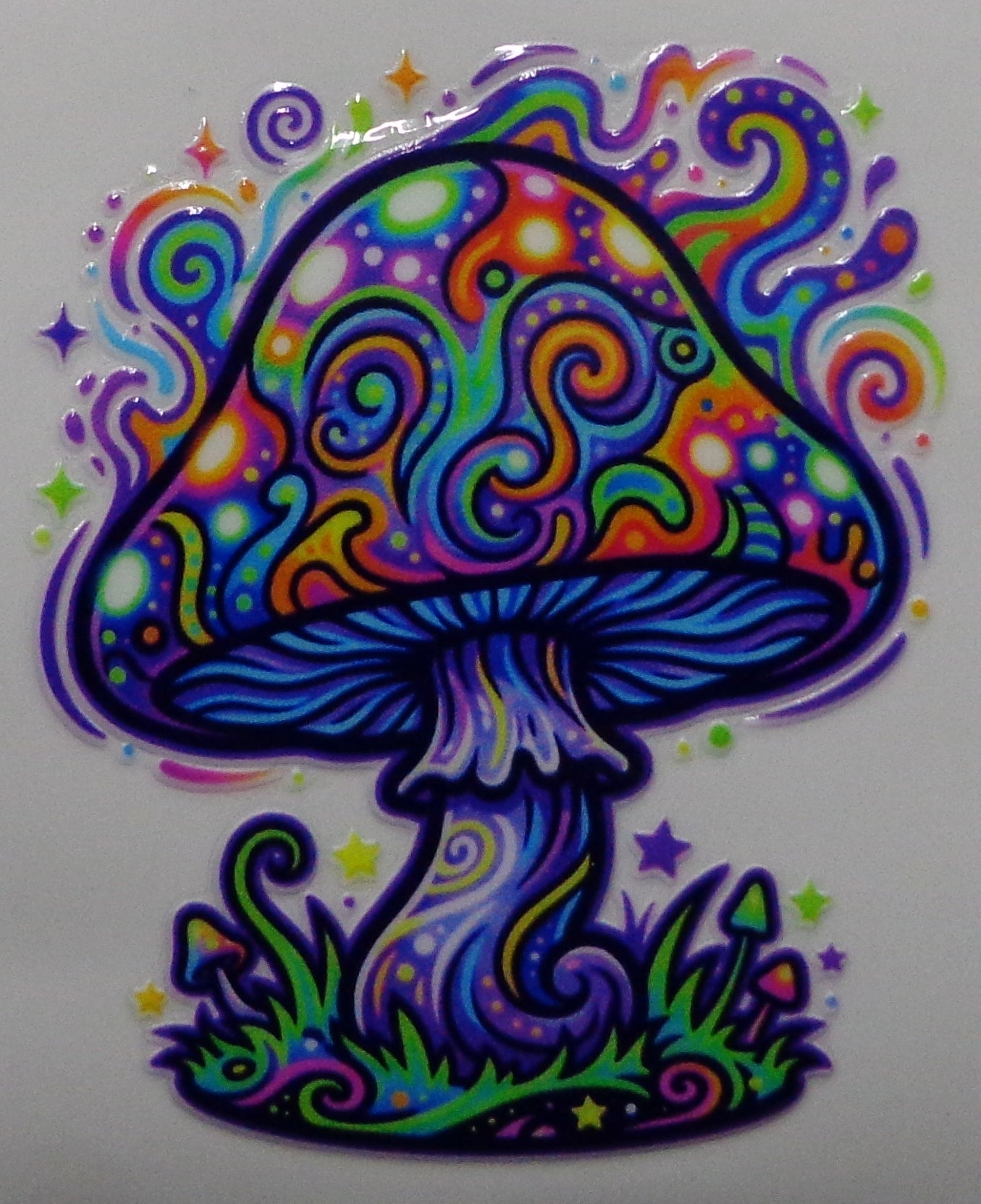 A colorful psychedelic mushroom sticker with swirling rainbow patterns, outlined in black, on a plain white background.
