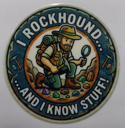 A circular novelty sticker featuring a cartoon rockhound explorer with a backpack, hat, and magnifying glass, surrounded by the text 'I ROCKHOUND... ....AND I KNOW STUFF.
