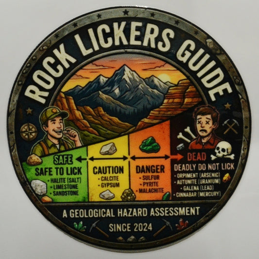 Circular sign titled 'Rock Lickers Guide' with a mountain landscape and color-coded chart of dangers