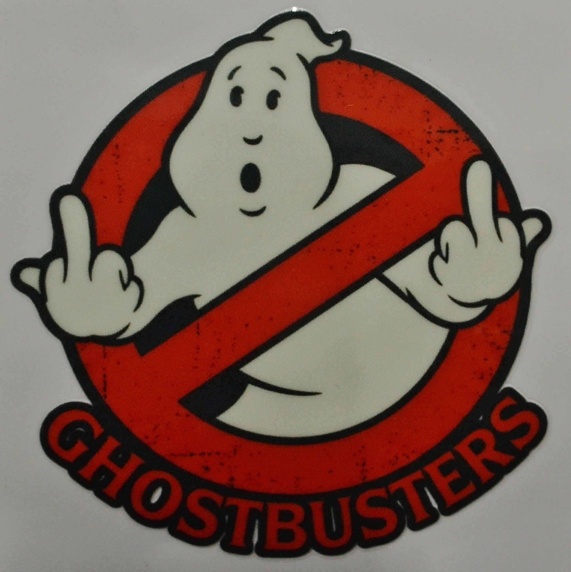 Ghostbusters logo with a ghost character and red circle with diagonal line 