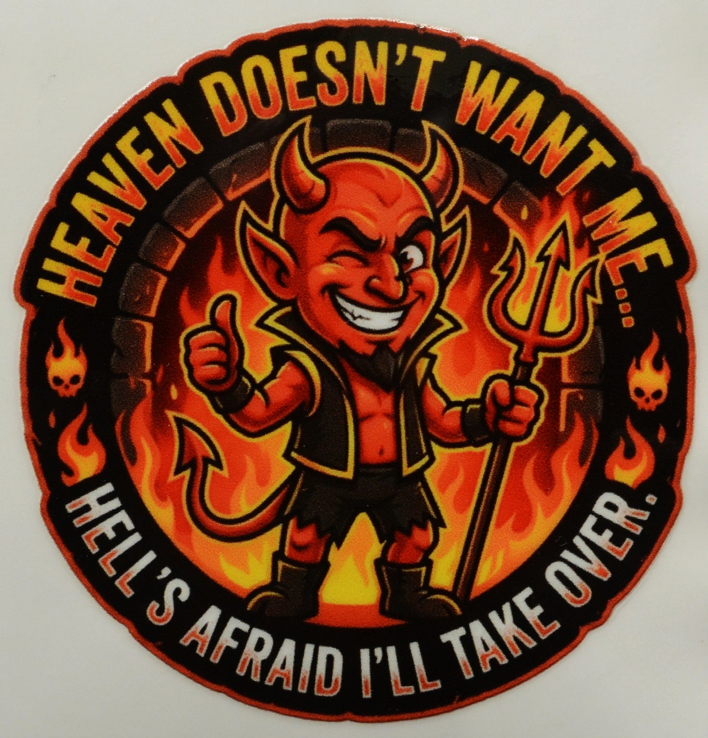Circular sticker with a devil character and text 'Heaven doesn't want me.