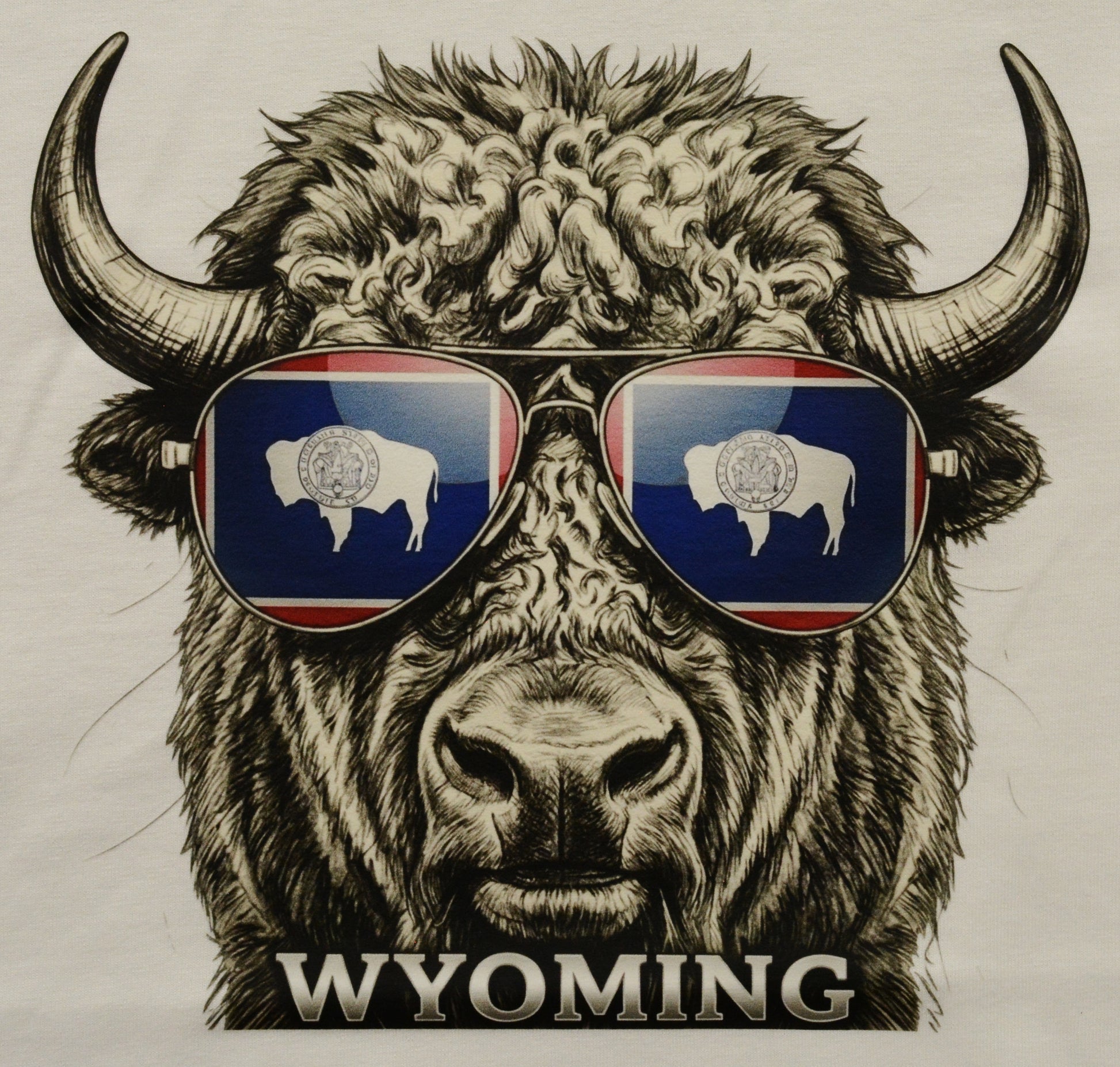 Bison wearing sunglasses with Wyoming flag design and 'Wyoming' text on a white shirt